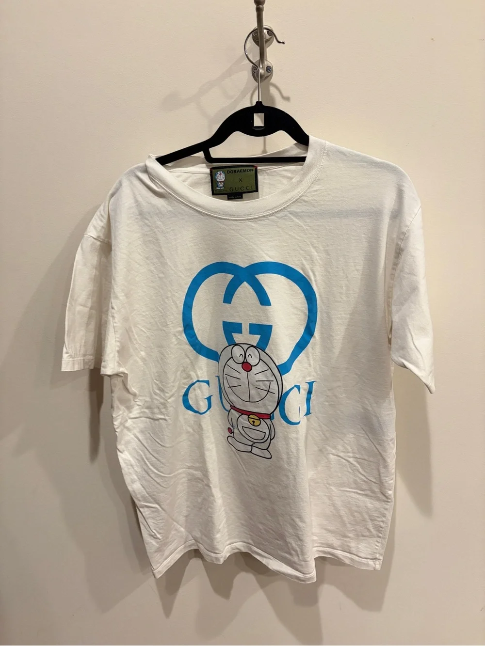 Gucci White Tee with Blue Logo and Doraemon Graphic